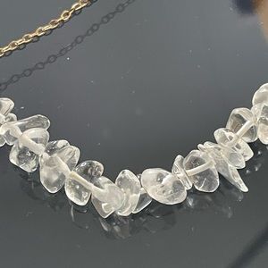 Necklace 21" looks like ice or quartz crystal. Gold chain. Smoke free.